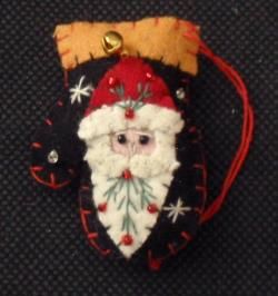 SANTA ON BLACK MITTEN ORNAMENT