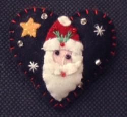 SANTA ON BLACK HEART PIN