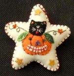 WHITE STAR W/CAT IN PUMPKIN ORNAMENT
